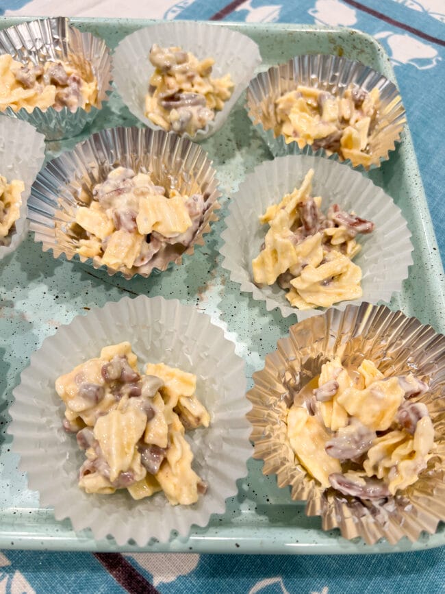cupcake liners with potato chip, chocolate and pecan snack