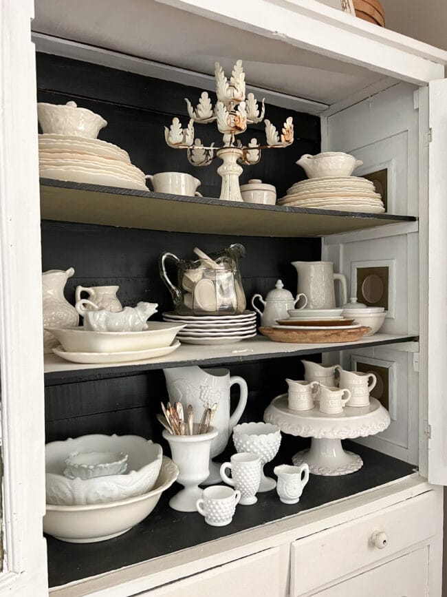 hutch shelves full of white dishes