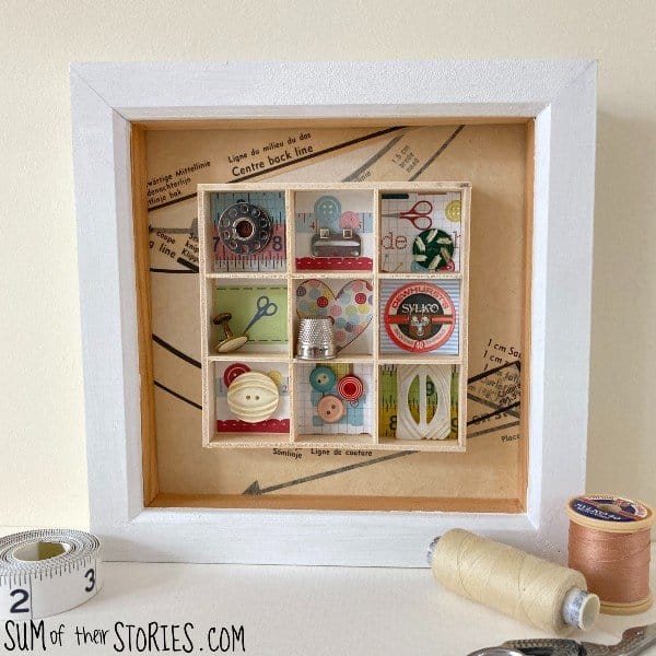 shadow box with sewing supplies