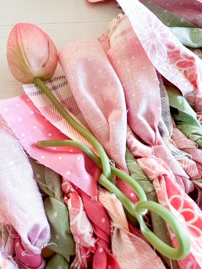 pink and green fabric scraps with a single pink tulip