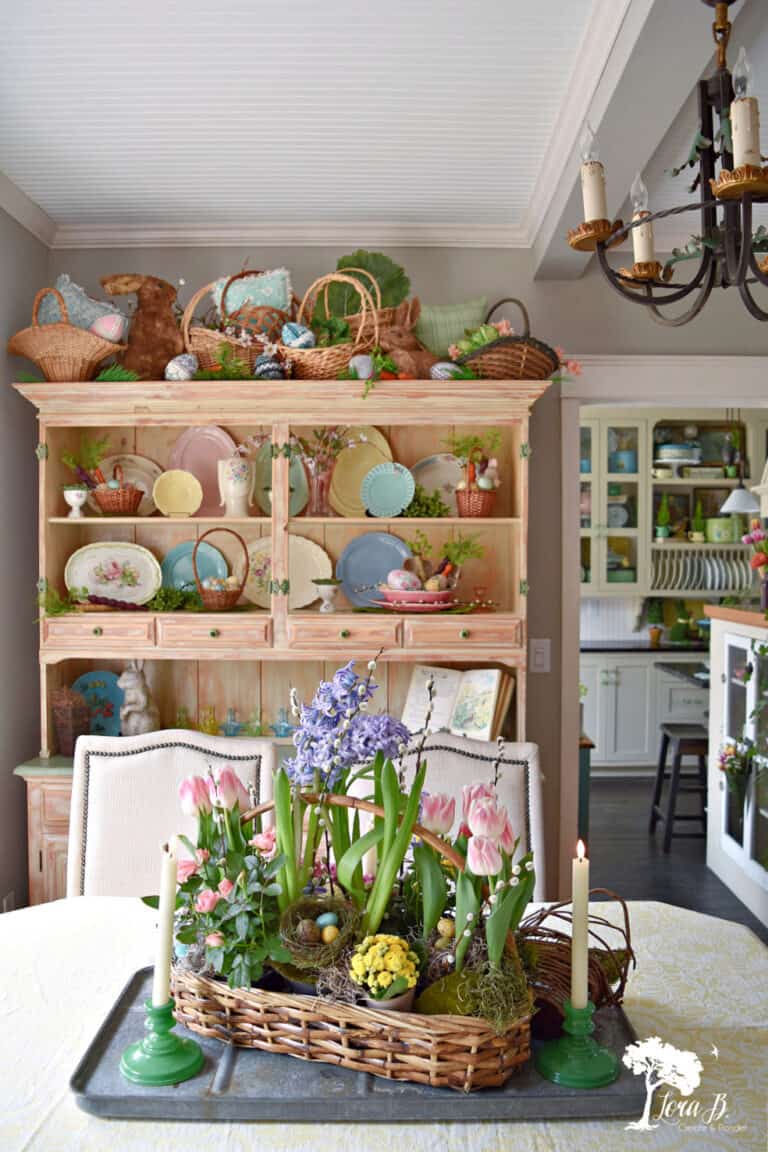 dining hutch and table with Easter plates, and flowers