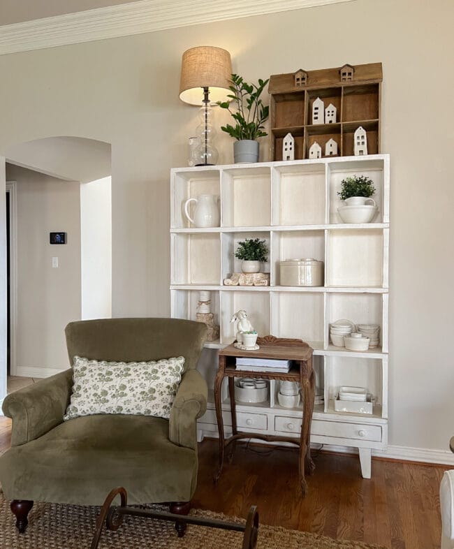 green chair with cubby shelf