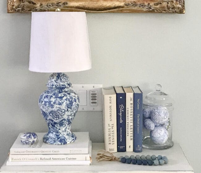 blue and white lamp with books and balls