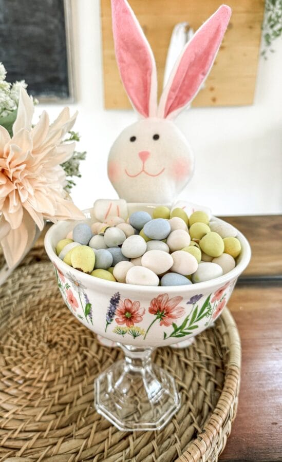 bunny on the back of a candy dish made from a bowl with flowers on it