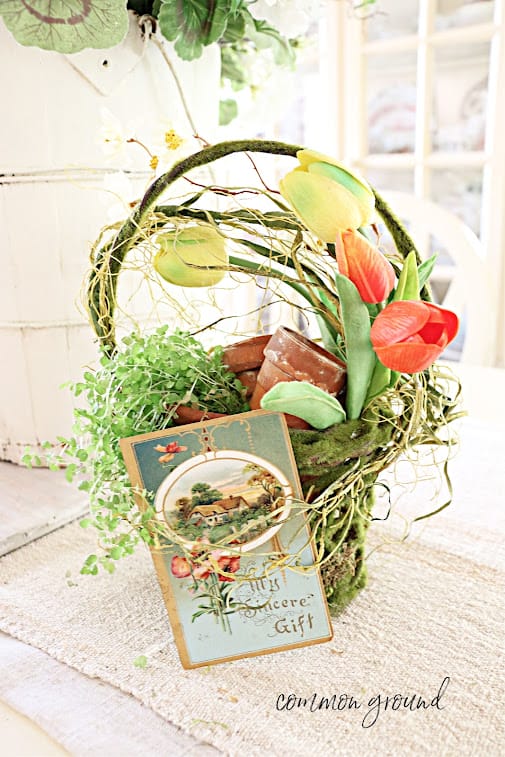 may basket with vintage card, green basket with yellow and orange tulips