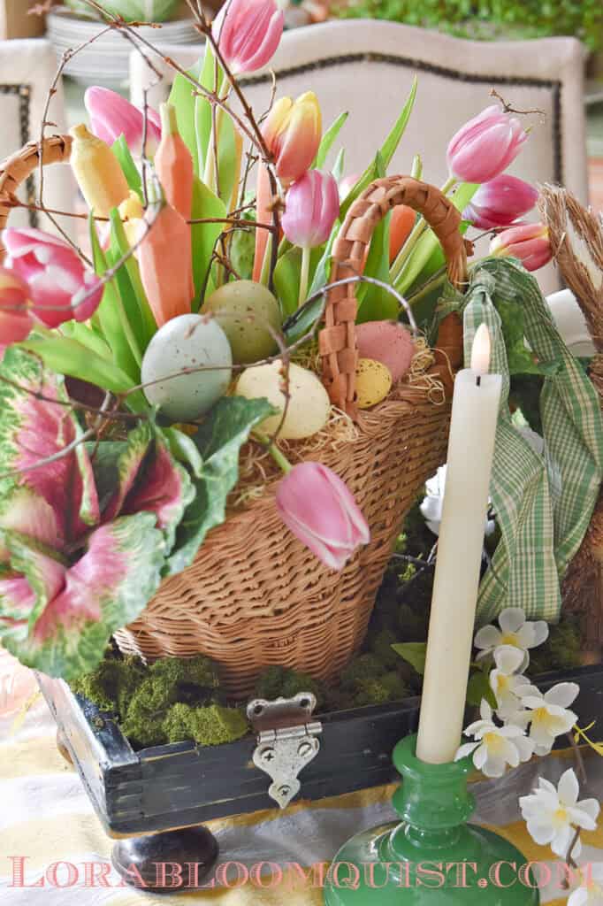 basket of flowers with eggs and real carrots too