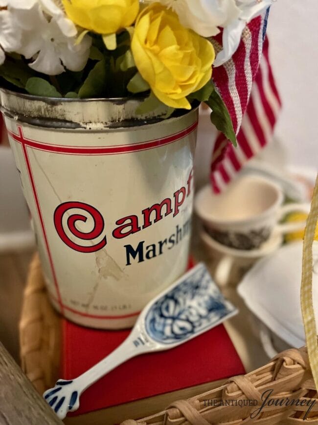 campfire can with flag and vintage dishes