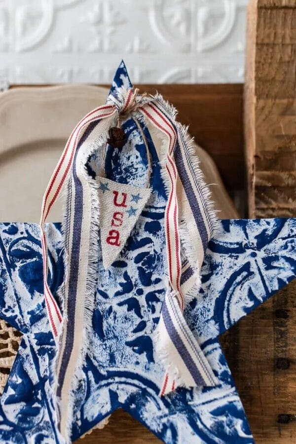 blue and white tin star with patriotic ribbons
