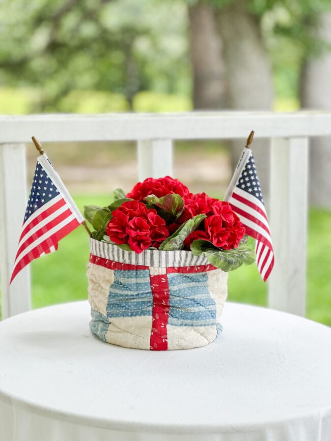 small quilted bowl with red flowers and flags