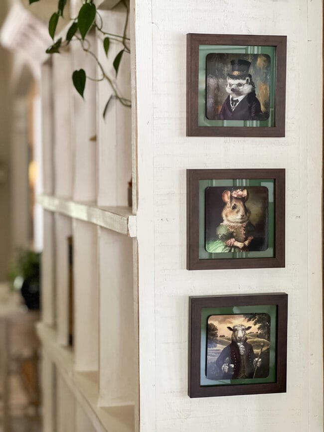 3 framed animal coasters hanging on a white cubby hutch