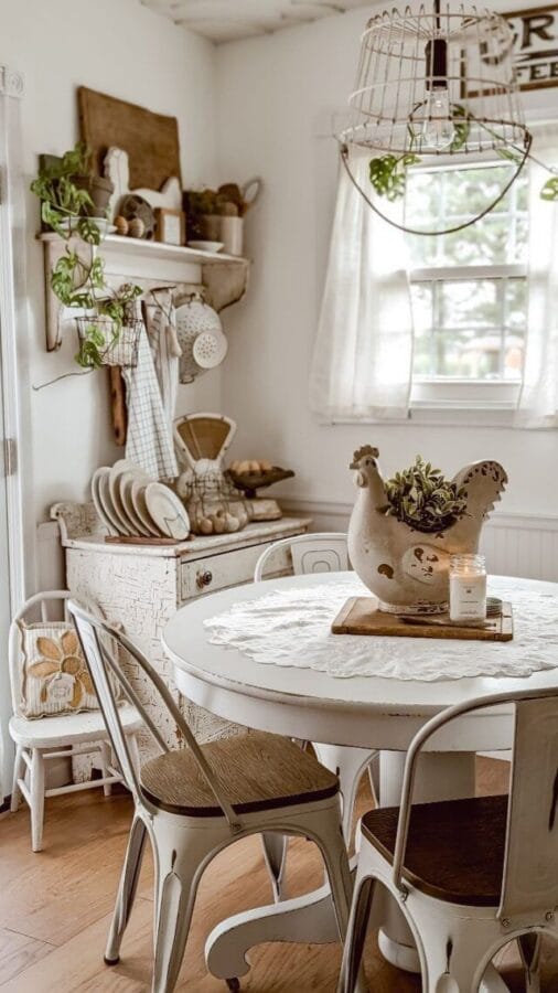 kitchen with a round white table, chicken on a cutting board for a centerpiece