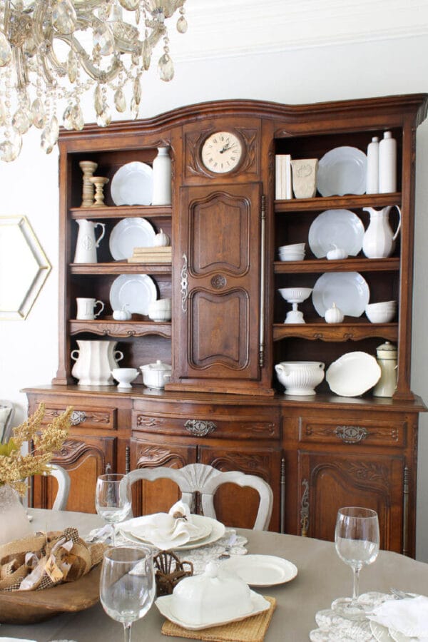 wood hutch with white plates