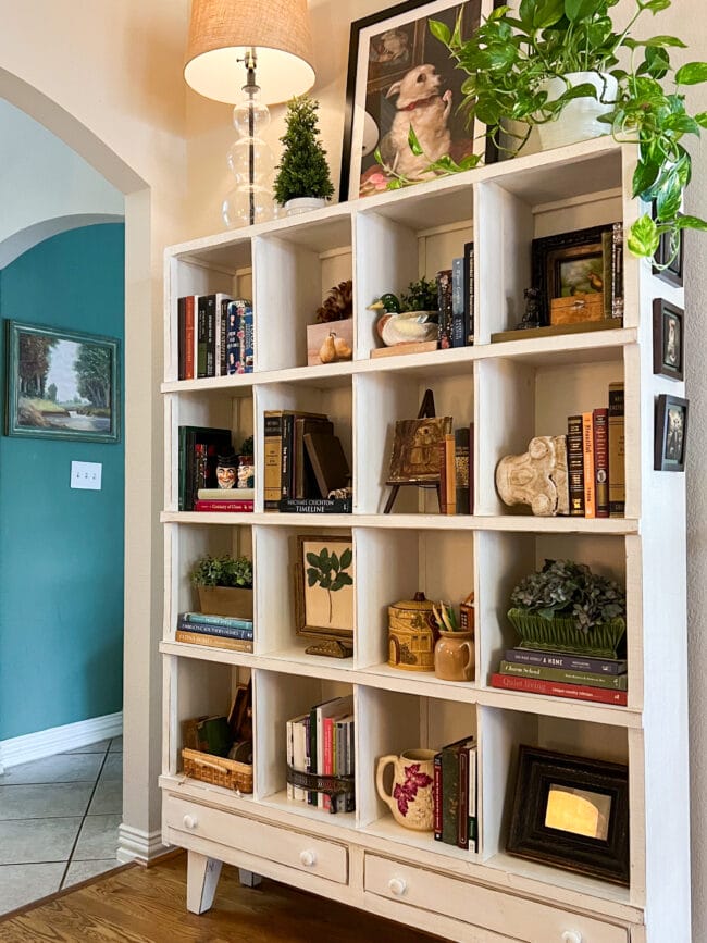 cubby shelf with books, and fall decor