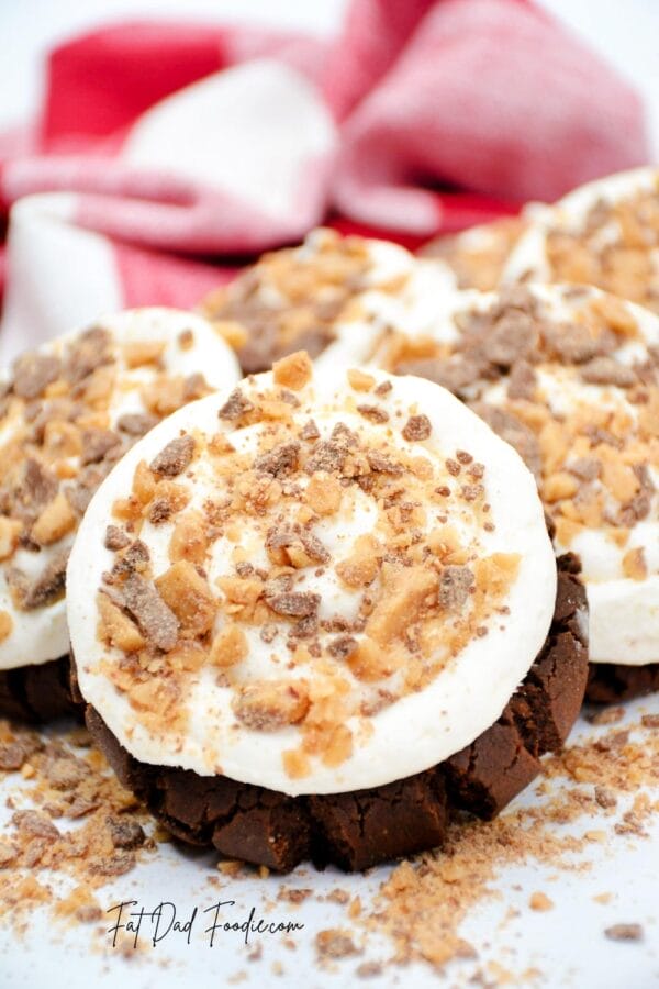 heath bar cookies stacked with crumbles all around