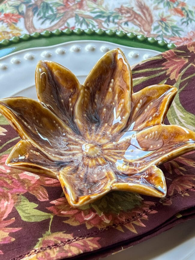 close up of gold poinsettia dish