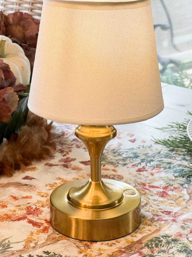 small gold lamp with white shade