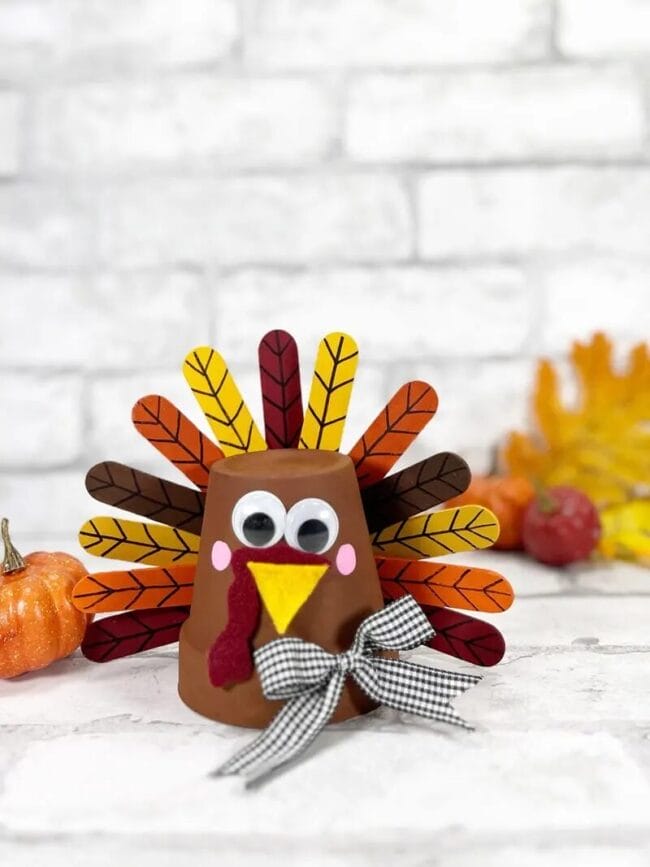 turkey craft for kids made from a clay pot. 