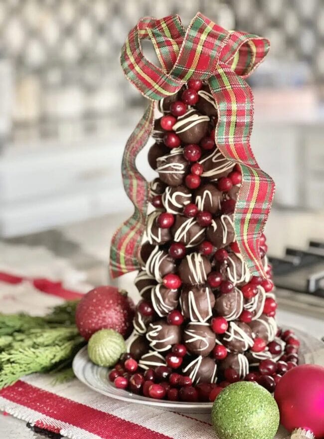 cone tree shaped chocolate truffle tree with red plaid ribbon as a bow on top
