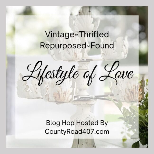 gray and white graphic with a vintage candelabra in the background