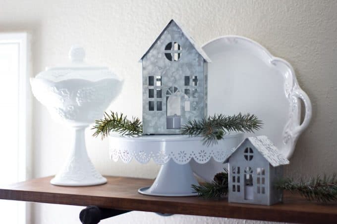 white dishes ad galvanized houses sitting on a shelf