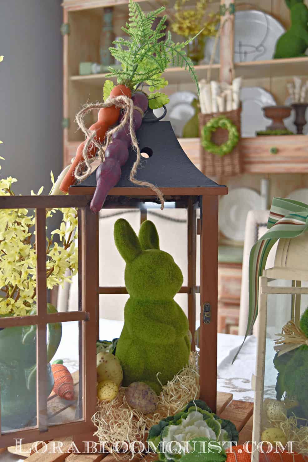 brown lantern with green bunny and wooden carrots on the top