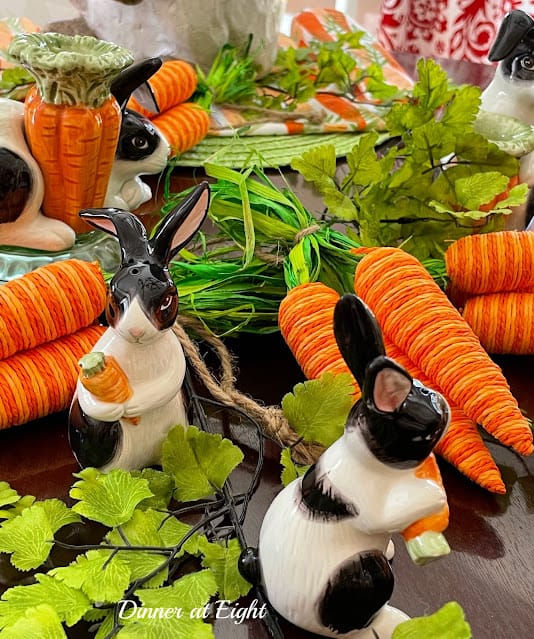 orange carrots and black and white bunnies covering a table setting