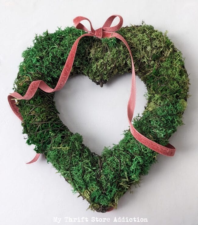 green moss heart with pink velvet ribbon bow