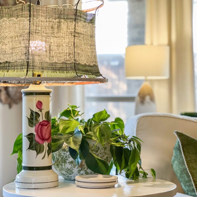 vintage pink and green floral lamp with a handmade lampshade and a green plant 