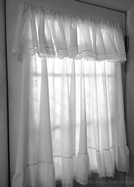 white curtain with a valance hanging on a door