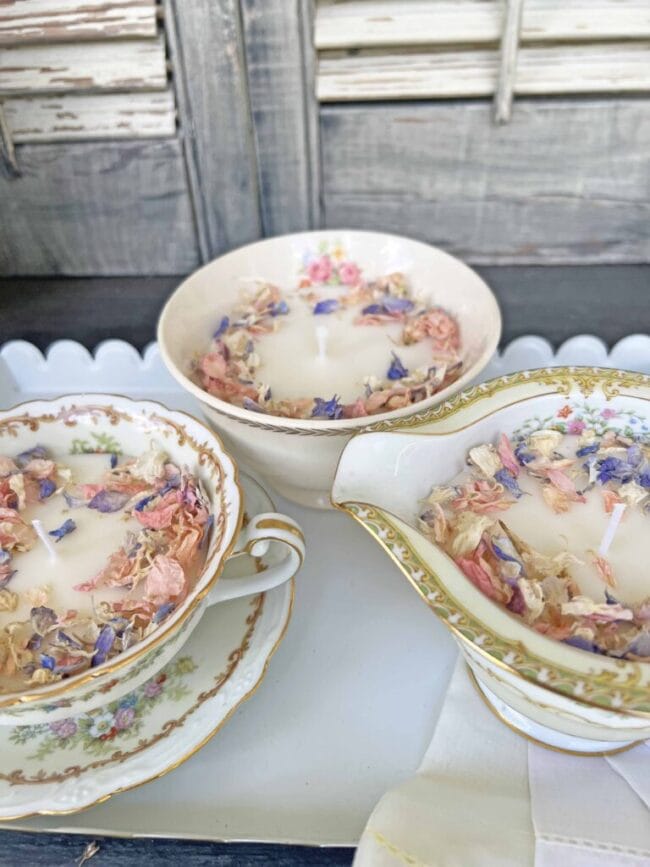 3 vintageteacups and bowls with handmade candles inside and potpourri