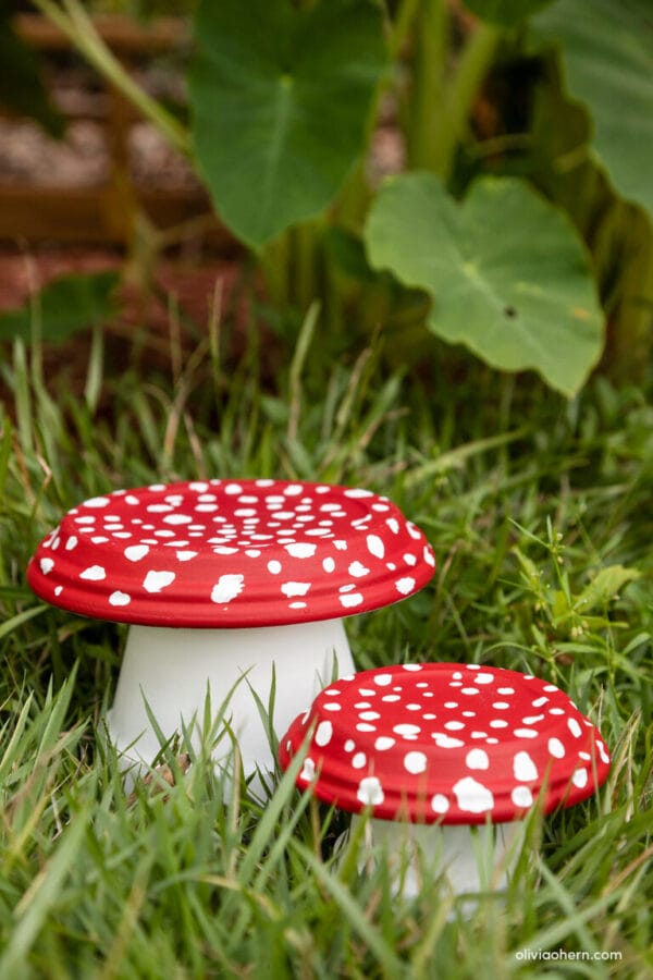painted red and white polka dot mushroom garden decor made from clay pots 