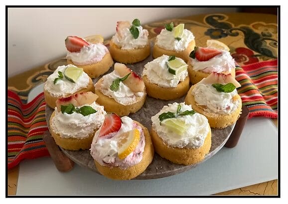 platter of summer desserts with fruit on top