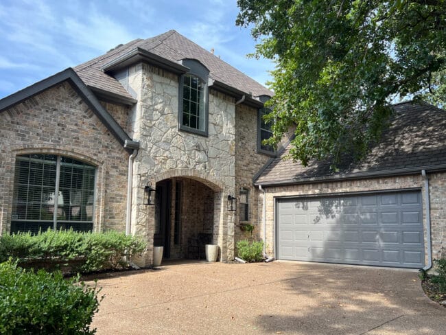 stone and brick house with gray trim
