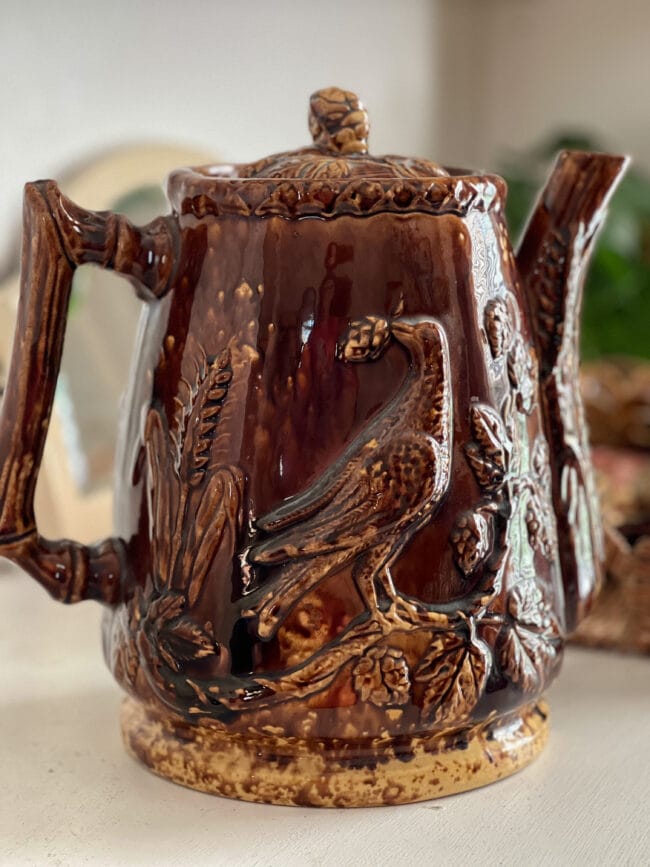 close up of large vintage ale pitcher with acorn lid