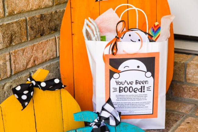 Boo bag on porch with pumpkins